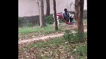Indian couple kissing in park 1