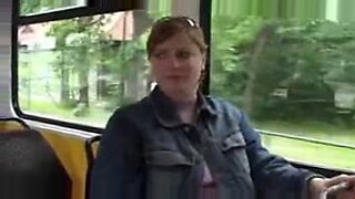 Busty woman milks on public bus.