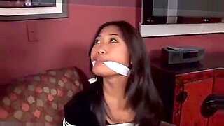 Asian beauty bound and teased in intense BDSM encounter.