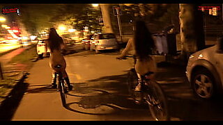 Riding our bike bare through the streets of the city