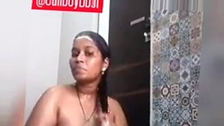 Indian beauty indulges in solo shower session, showcasing stunning curves.